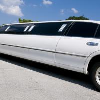 A beautiful white stretch limousine.