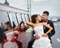 Bride & groom next to their Hummer Limousine.